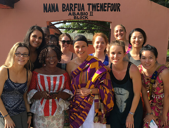Study Abroad students cheerfully gather together.